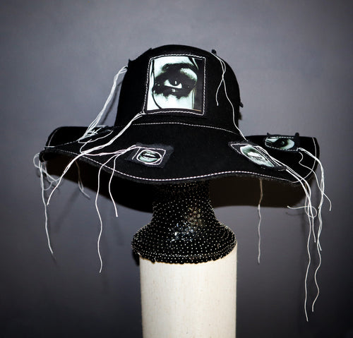 100% WOOL HAT W/ BLACK + WHITE EYE GRAPHICS + TOPSTITCH DETAIL