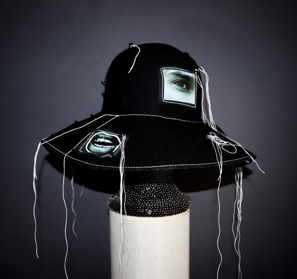 100% WOOL HAT W/ BLACK + WHITE EYE GRAPHICS + TOPSTITCH DETAIL