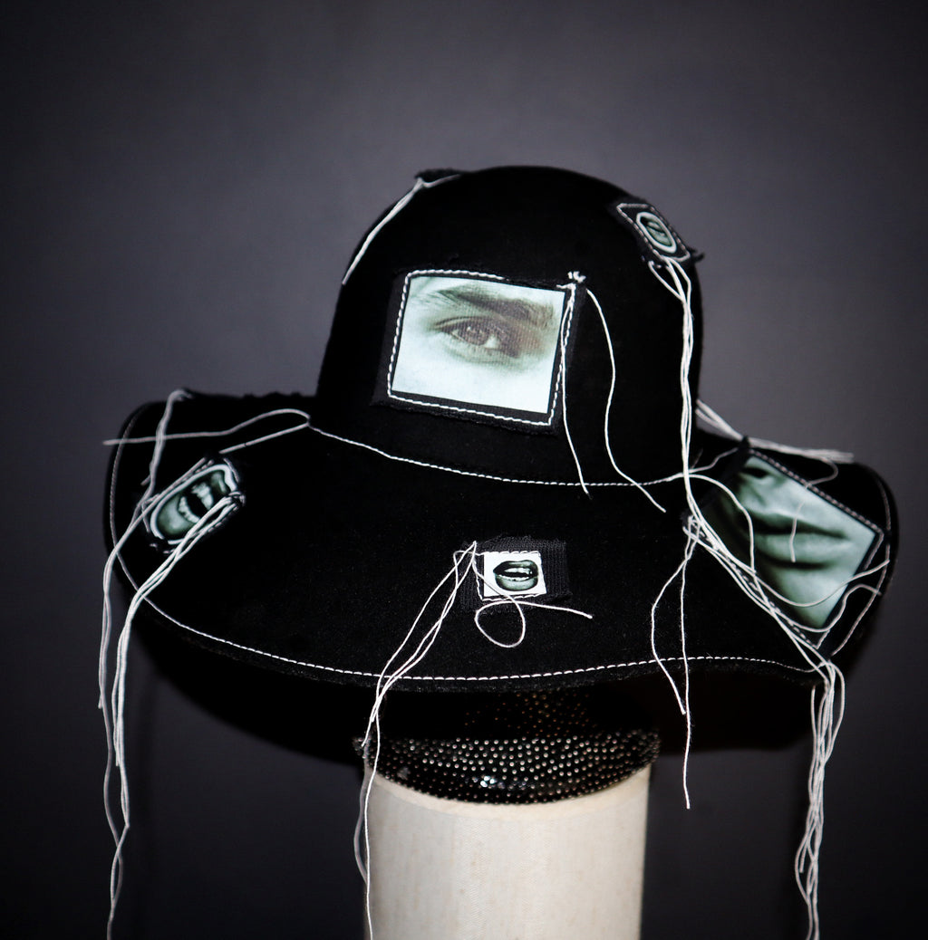 100% WOOL HAT W/ BLACK + WHITE EYE GRAPHICS + TOPSTITCH DETAIL