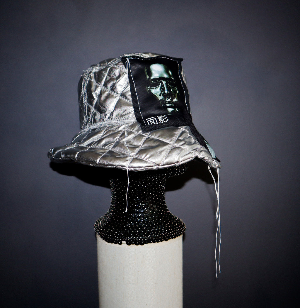 SILVER PUFF BUCKET HAT W/ EYE GRAPHICS